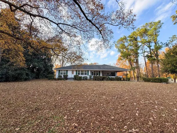 a view of house with outdoor space