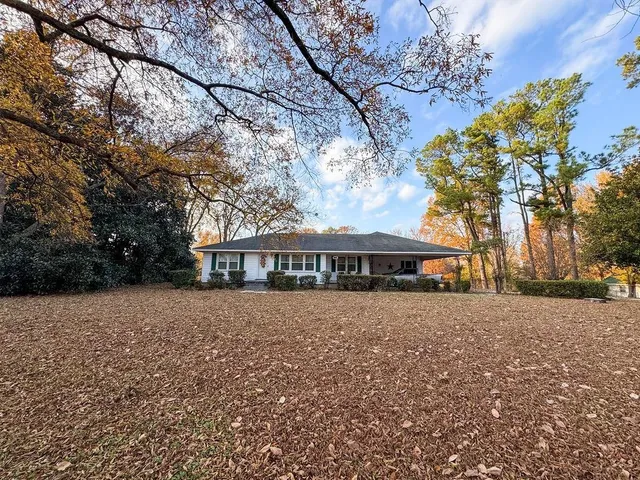 a view of house with outdoor space