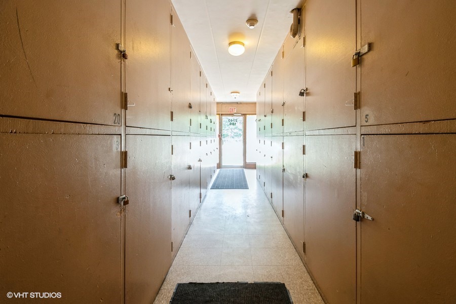2340 186th Street, Unit 28 Lansing, IL 60438 - Photo 12 of 14 a view of a hallway with wooden floor