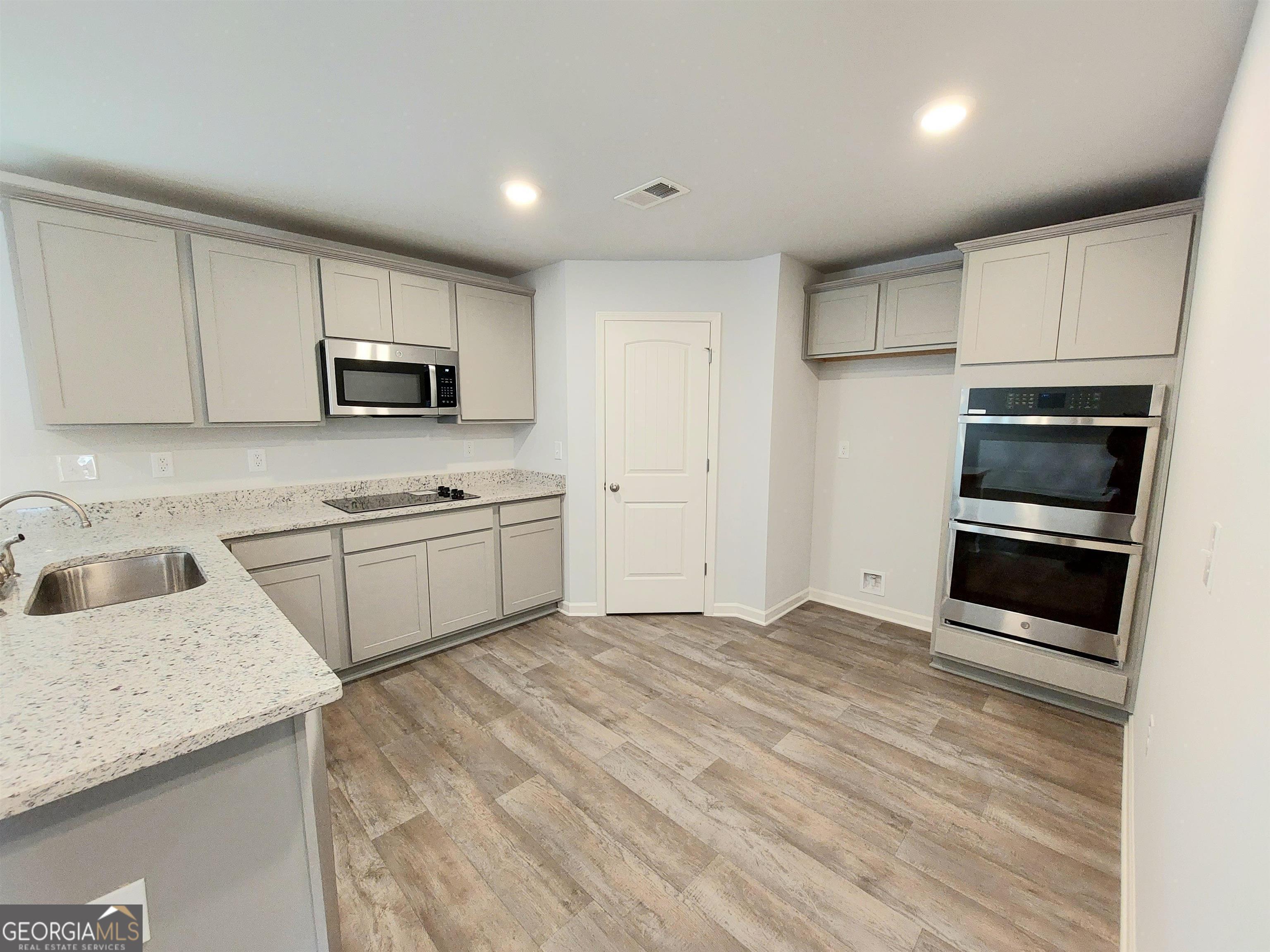 503 Holsteiner Road, Unit 67 Hogansville, GA 30230 - Photo 4 of 15 a kitchen with a sink appliances and cabinets