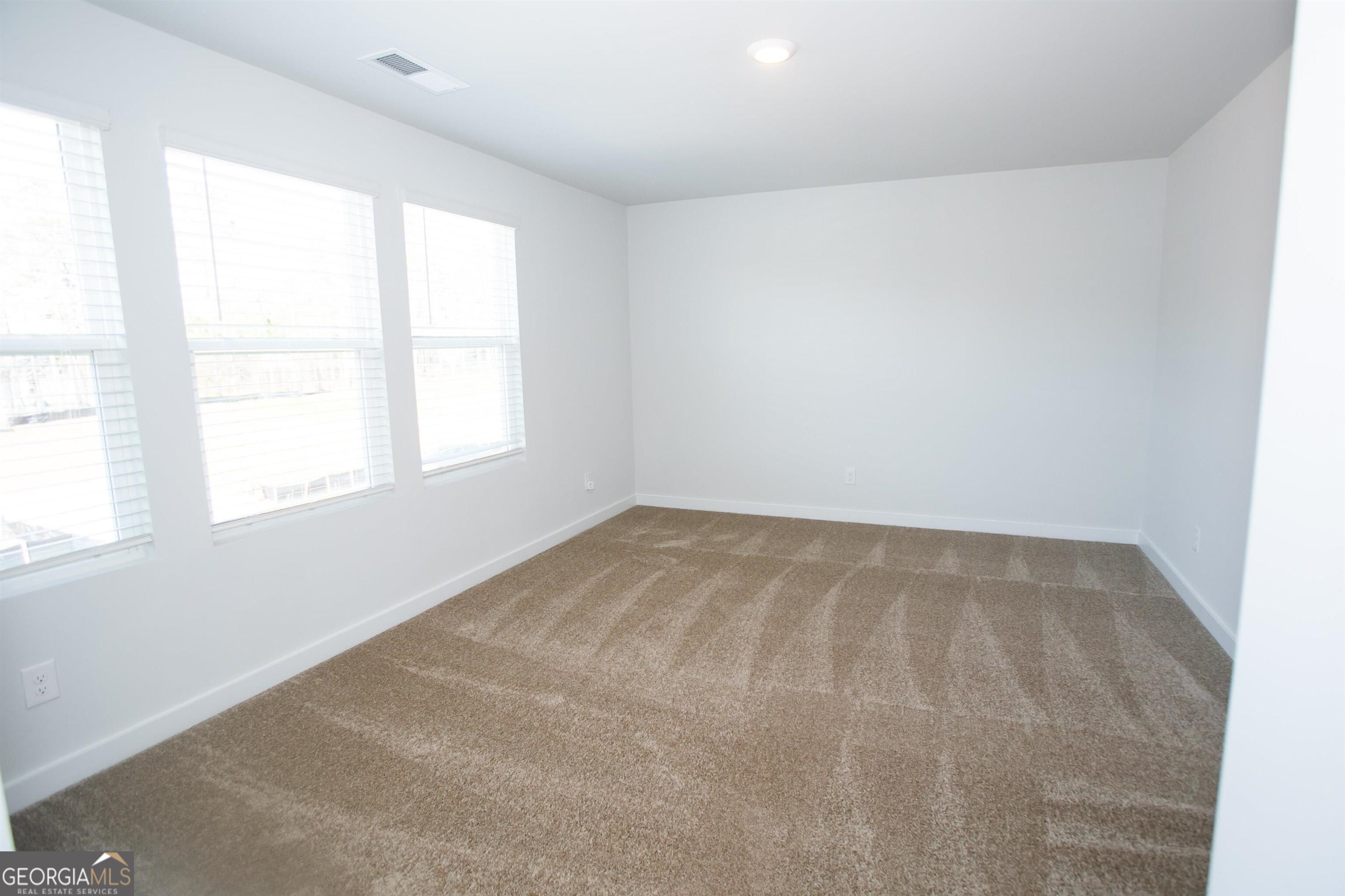 503 Holsteiner Road, Unit 67 Hogansville, GA 30230 - Photo 5 of 15 an empty room with a window