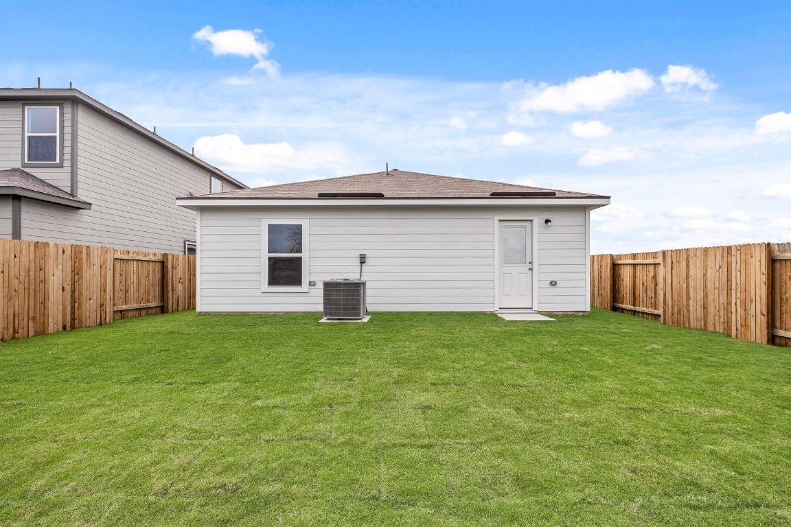 18308 Stellers Sea Street Elgin, TX 78621 - Photo 2 of 6 a view of a backyard space