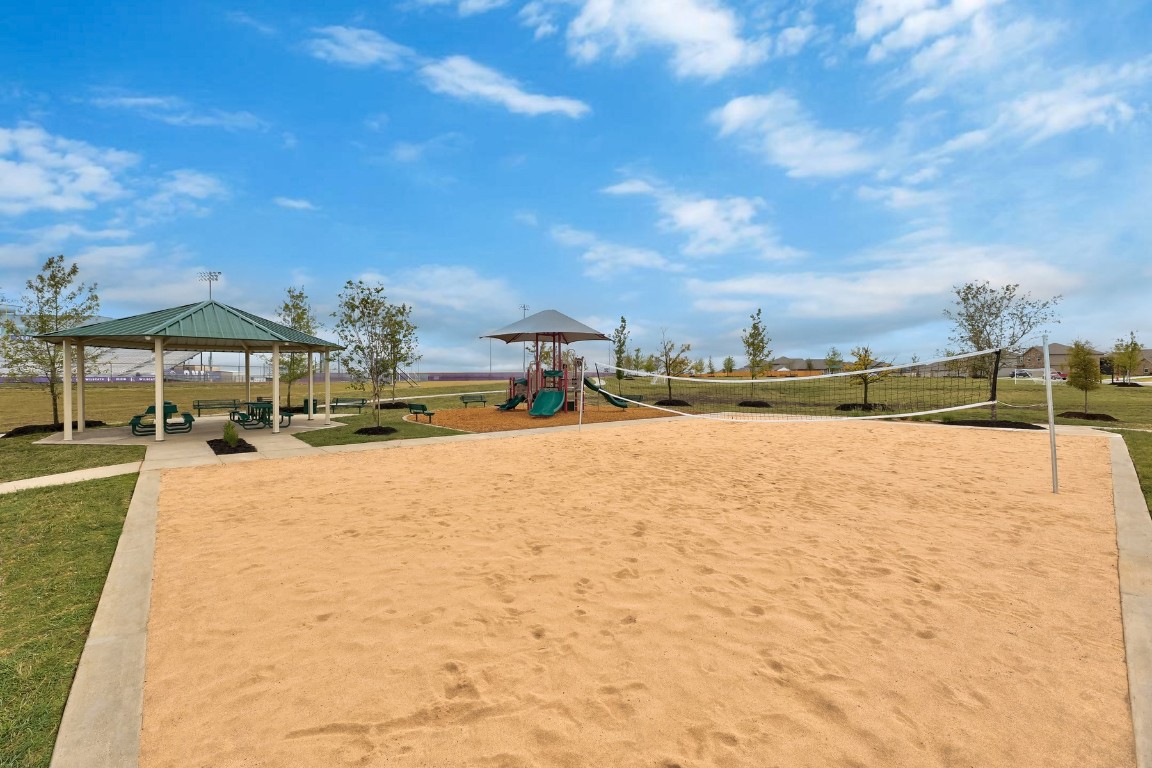 18308 Stellers Sea Street Elgin, TX 78621 - Photo 5 of 6 a view of swimming pool with outdoor seating and a pathway