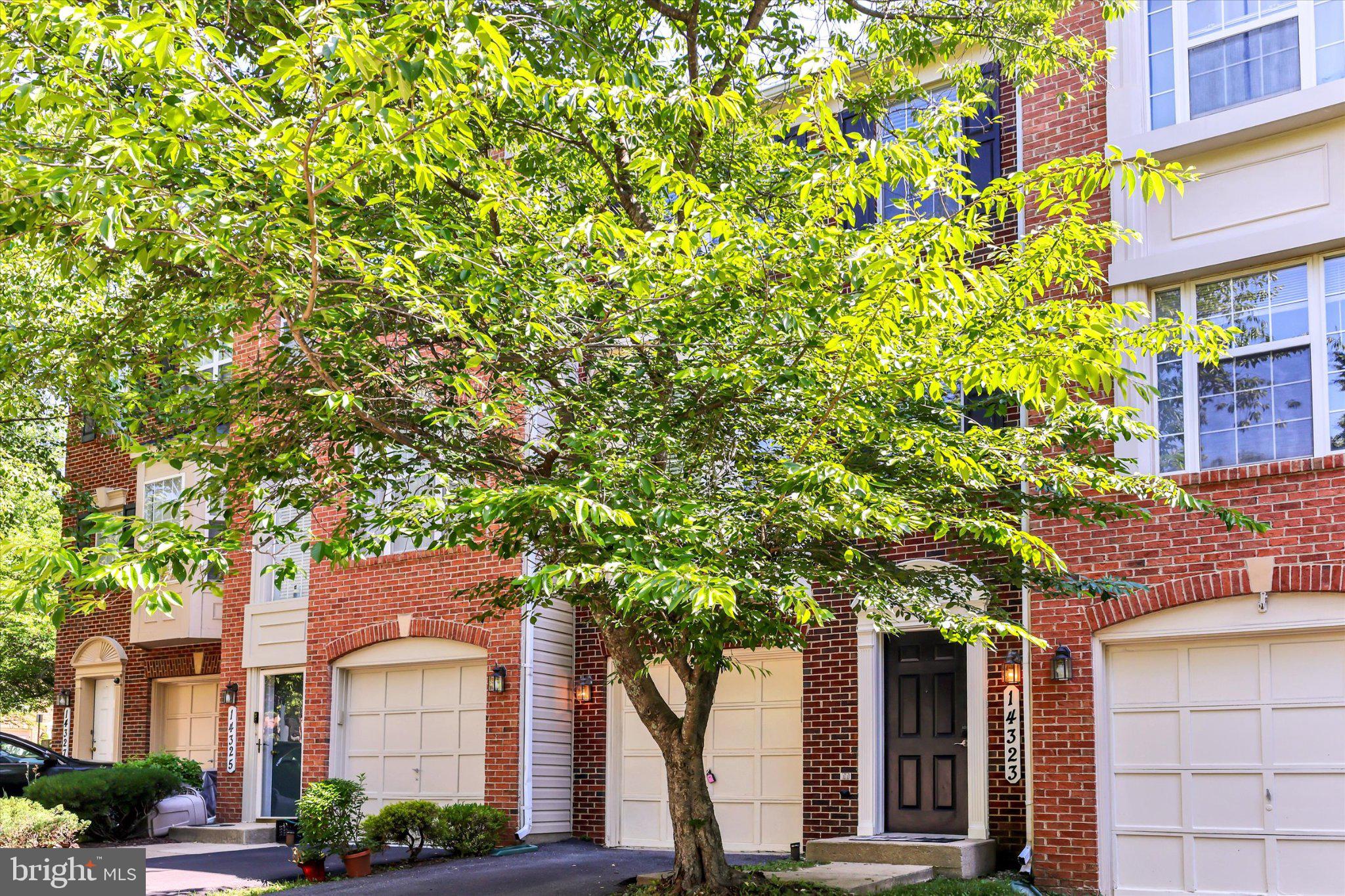14323 Gate Dancer Lane Boyds, MD 20841 - Photo 4 of 54 Charming townhouse with lush greenery.