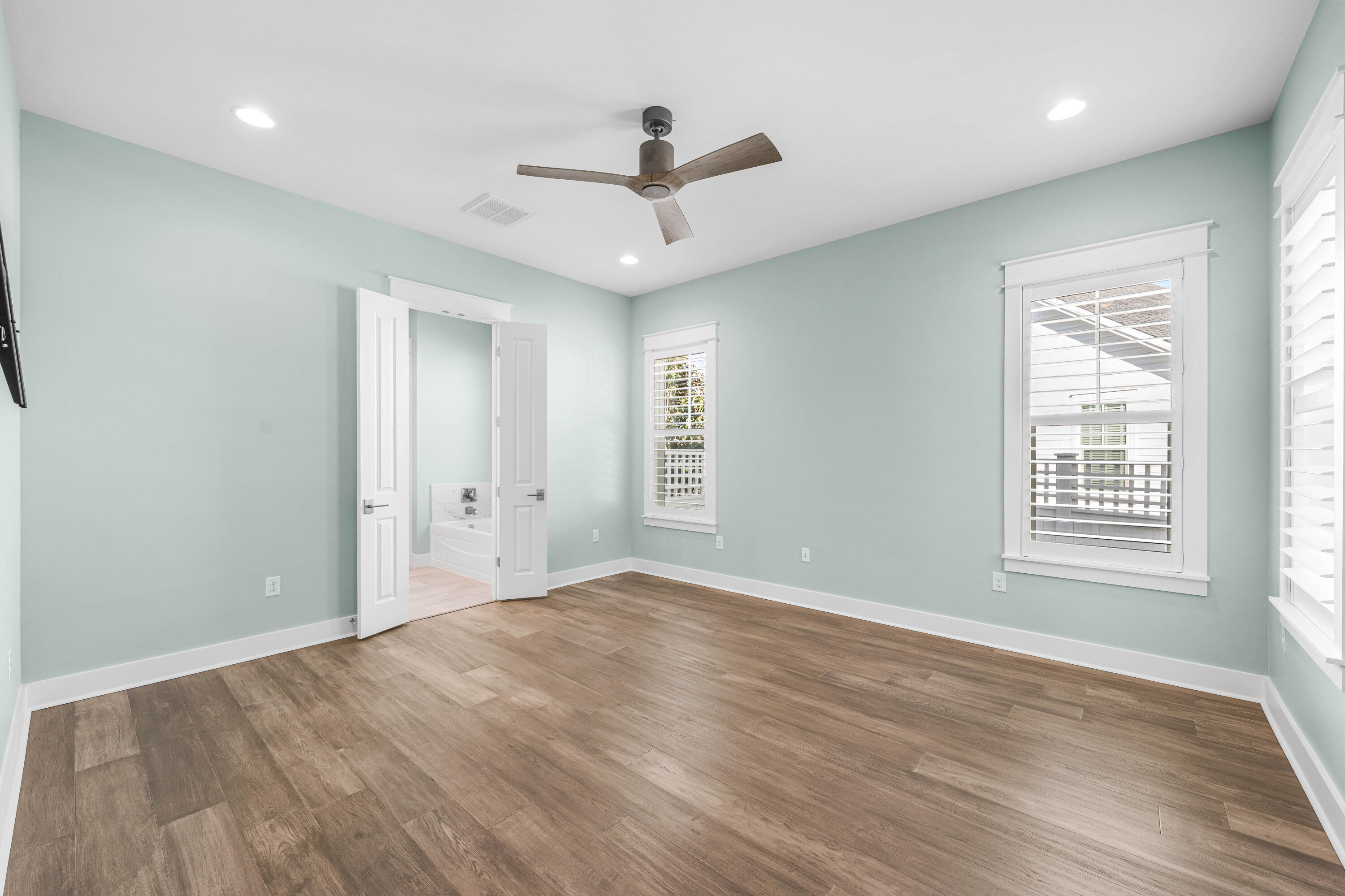 234 Sidecamp Rd Inlet Beach Inlet Beach, FL 32461 - Photo 22 of 57 a view of an empty room with wooden floor and a window