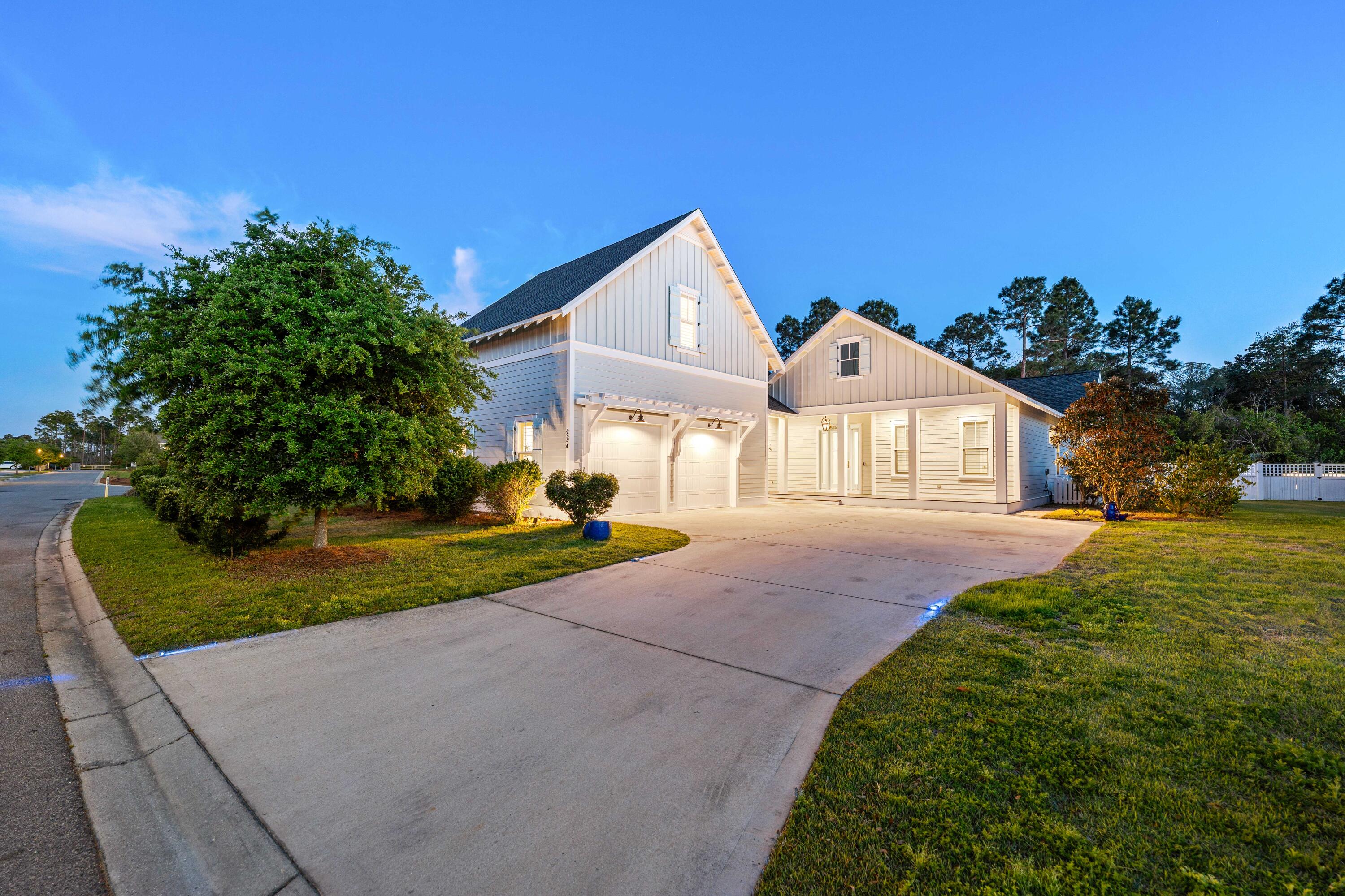 234 Sidecamp Rd Inlet Beach Inlet Beach, FL 32461 - Photo 48 of 57 a front view of a house with a yard and garage