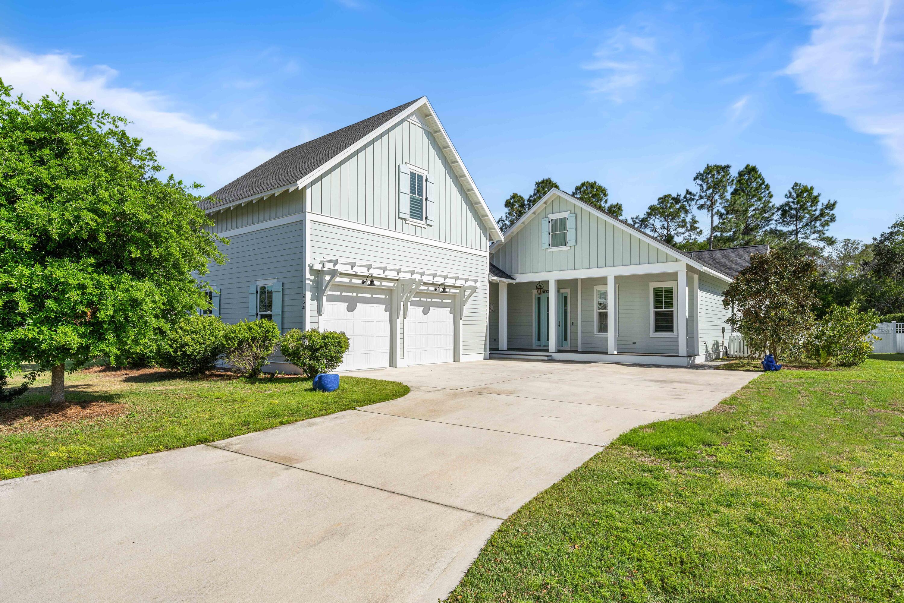 234 Sidecamp Rd Inlet Beach Inlet Beach, FL 32461 - Photo 49 of 57 a front view of a house with a yard and garage
