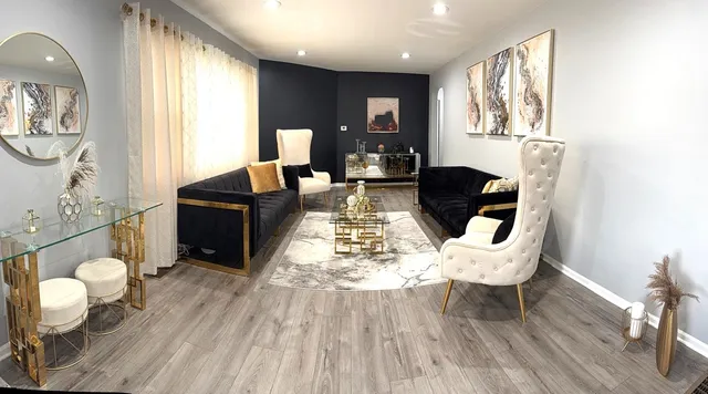 a living room with furniture and a large window