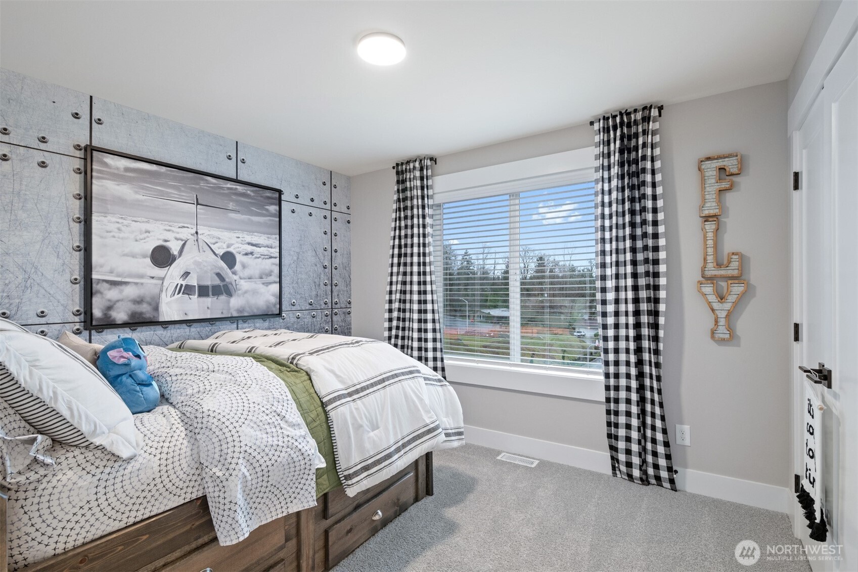 13031 75th Place South Seattle, WA 98178 - Photo 23 of 24 a bedroom with a bed and a large window