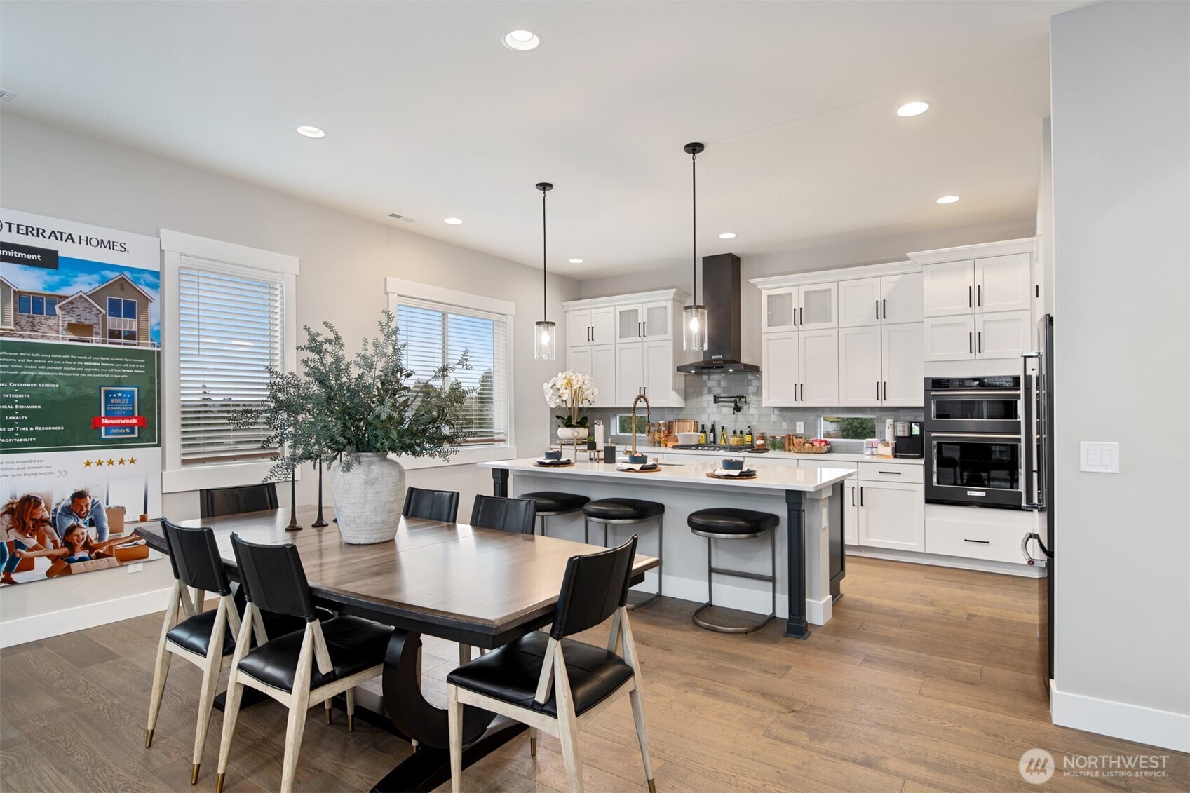 13031 75th Place South Seattle, WA 98178 - Photo 4 of 24 a kitchen with a dining table chairs and white cabinets