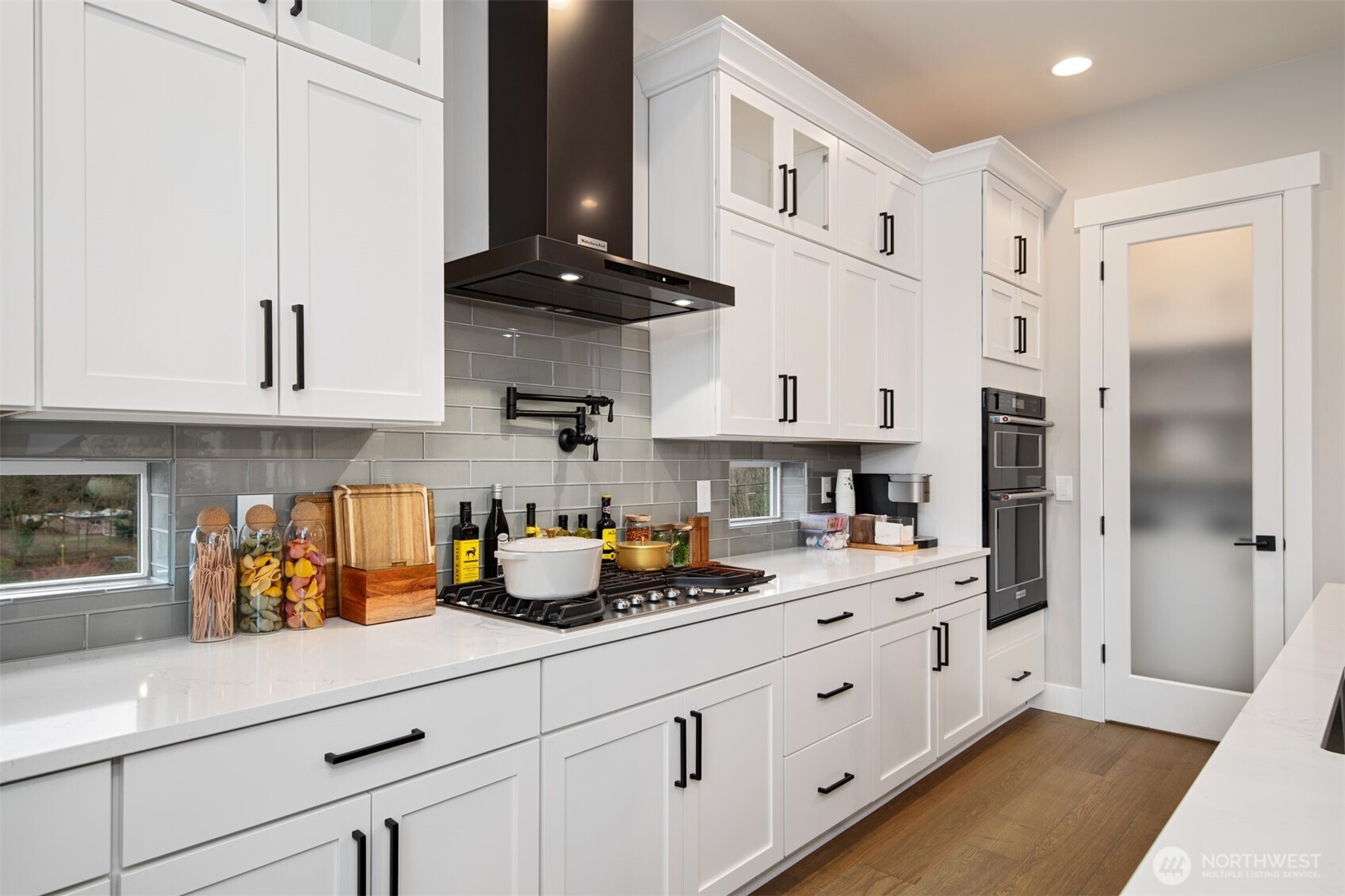13031 75th Place South Seattle, WA 98178 - Photo 10 of 24 a kitchen with stainless steel appliances white cabinets and a refrigerator