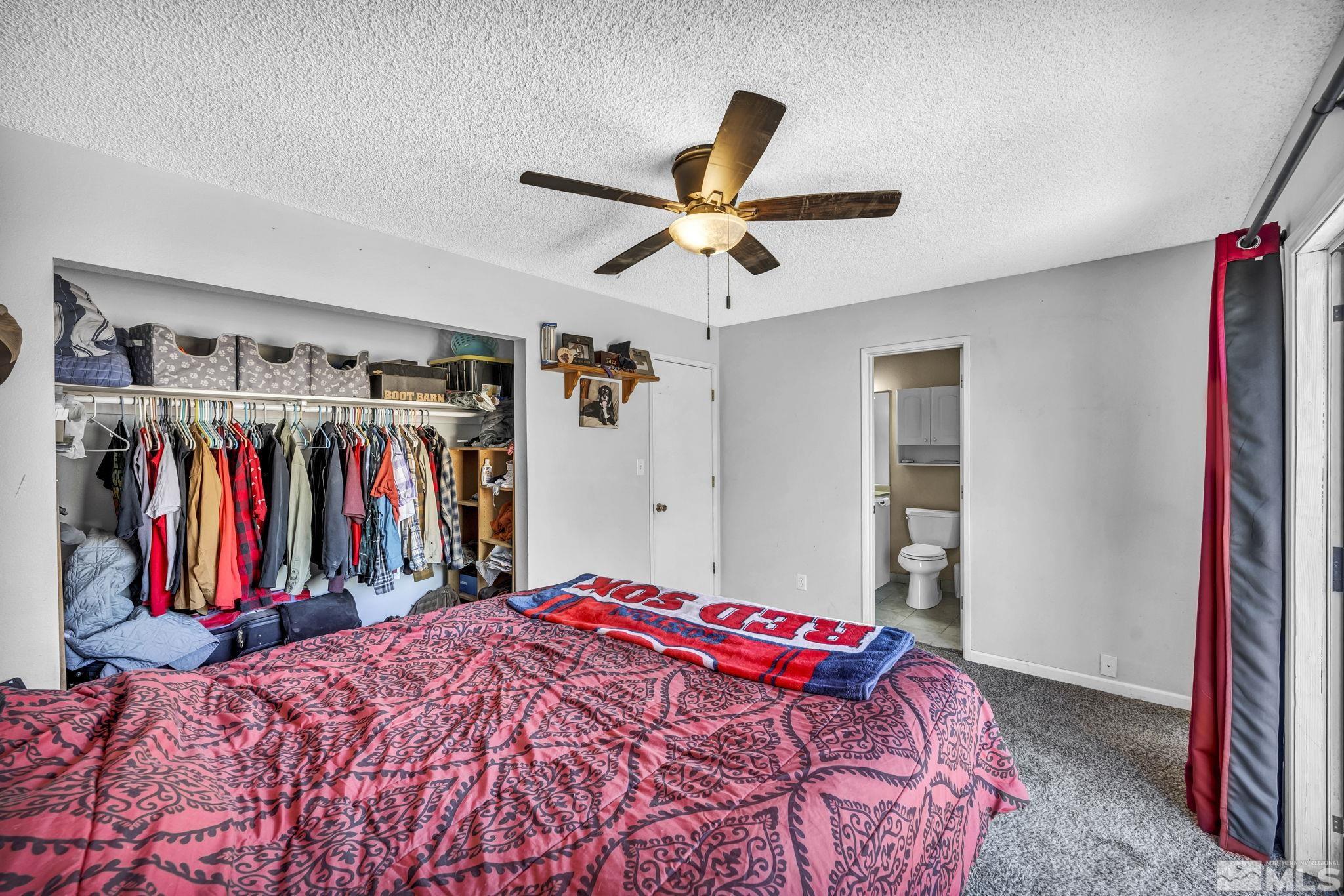 1011 Bonnie Lane Fallon, NV 89406 - Photo 15 of 31 a bed room with a bed and a walk in closet
