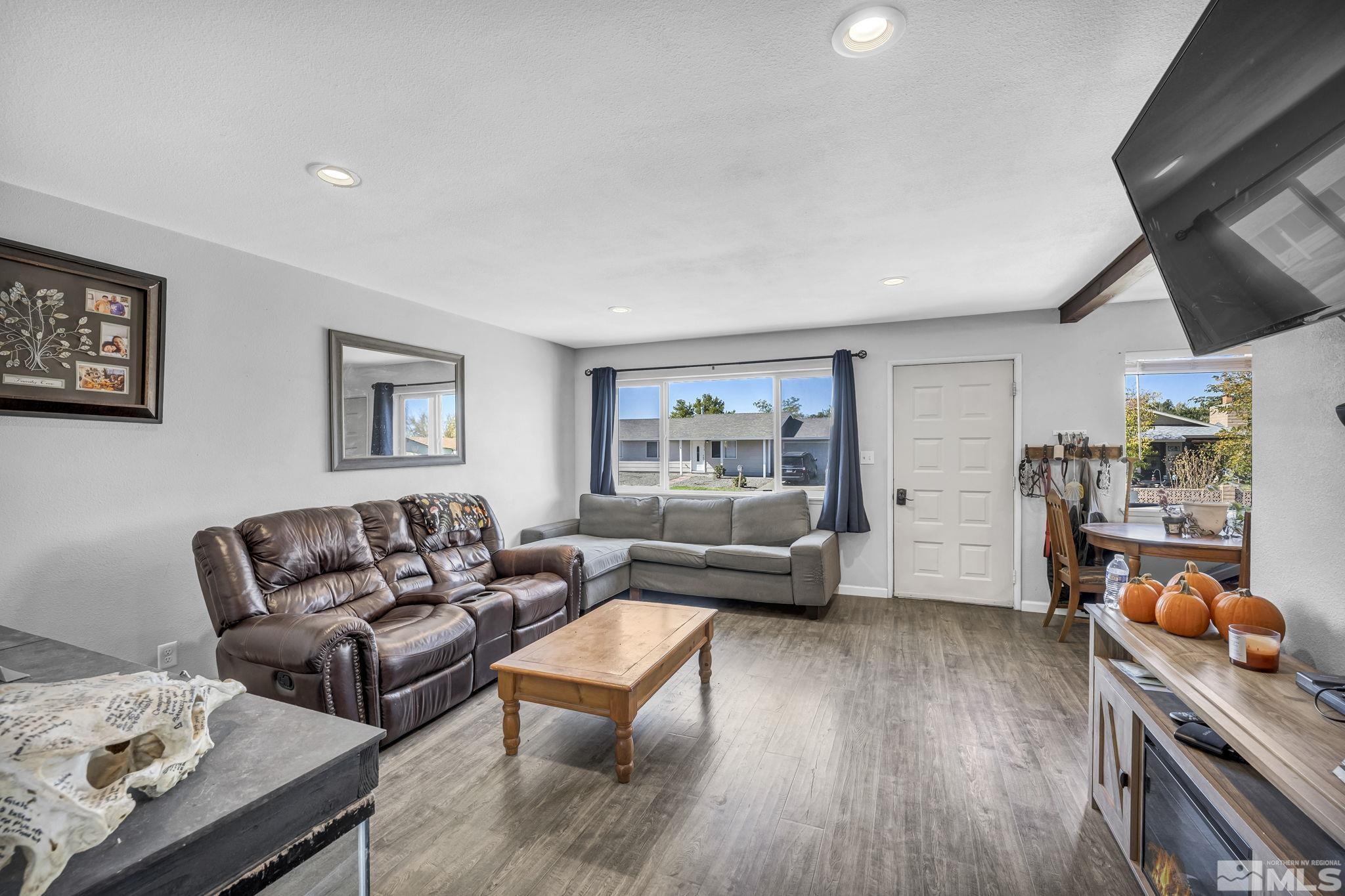 1011 Bonnie Lane Fallon, NV 89406 - Photo 5 of 31 a living room with furniture and a wooden floor