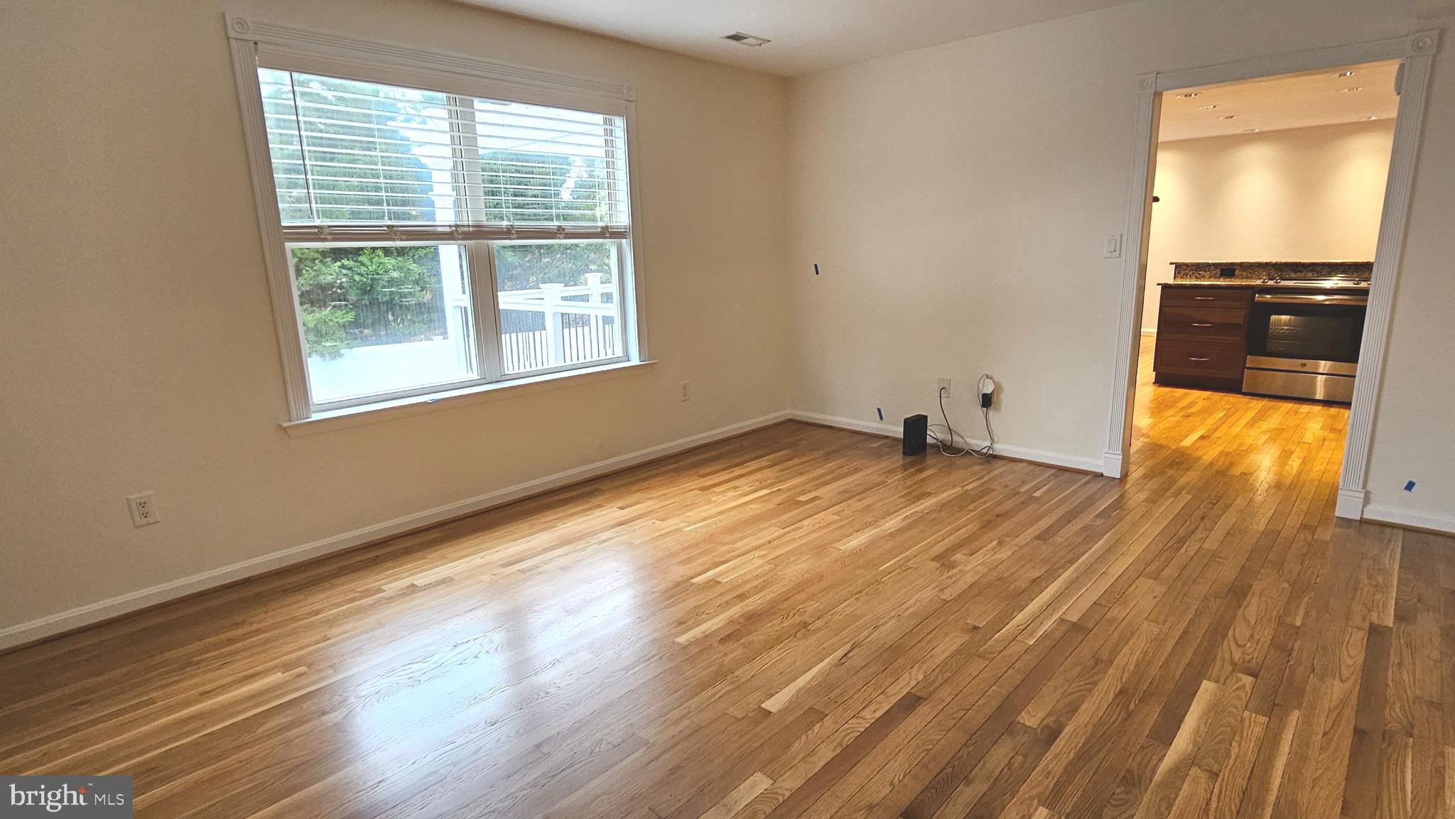 45655 Centerview Lane Great Mills, MD 20634 - Photo 12 of 38 a view of an empty room with wooden floor and a window