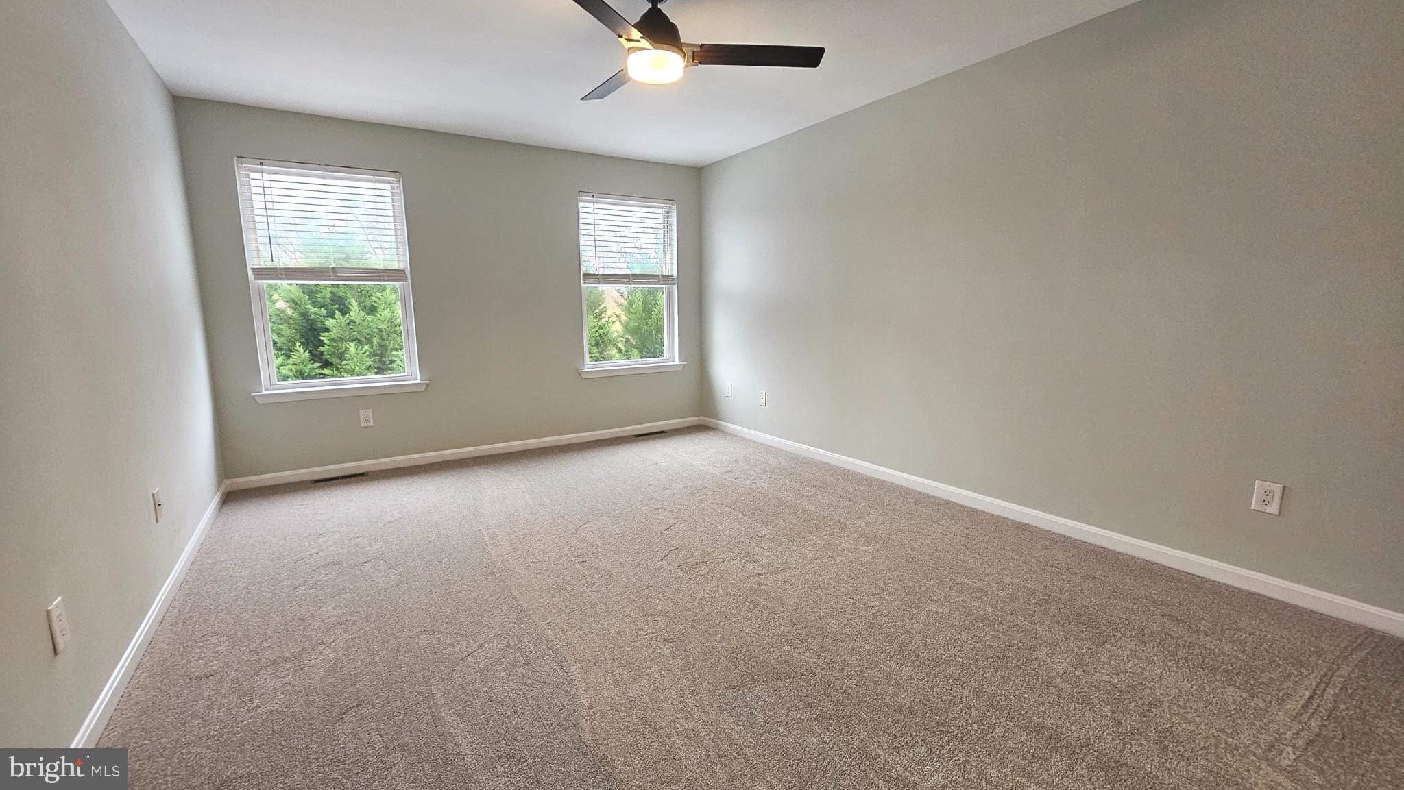 45655 Centerview Lane Great Mills, MD 20634 - Photo 16 of 38 an empty room with windows and ceiling fan view