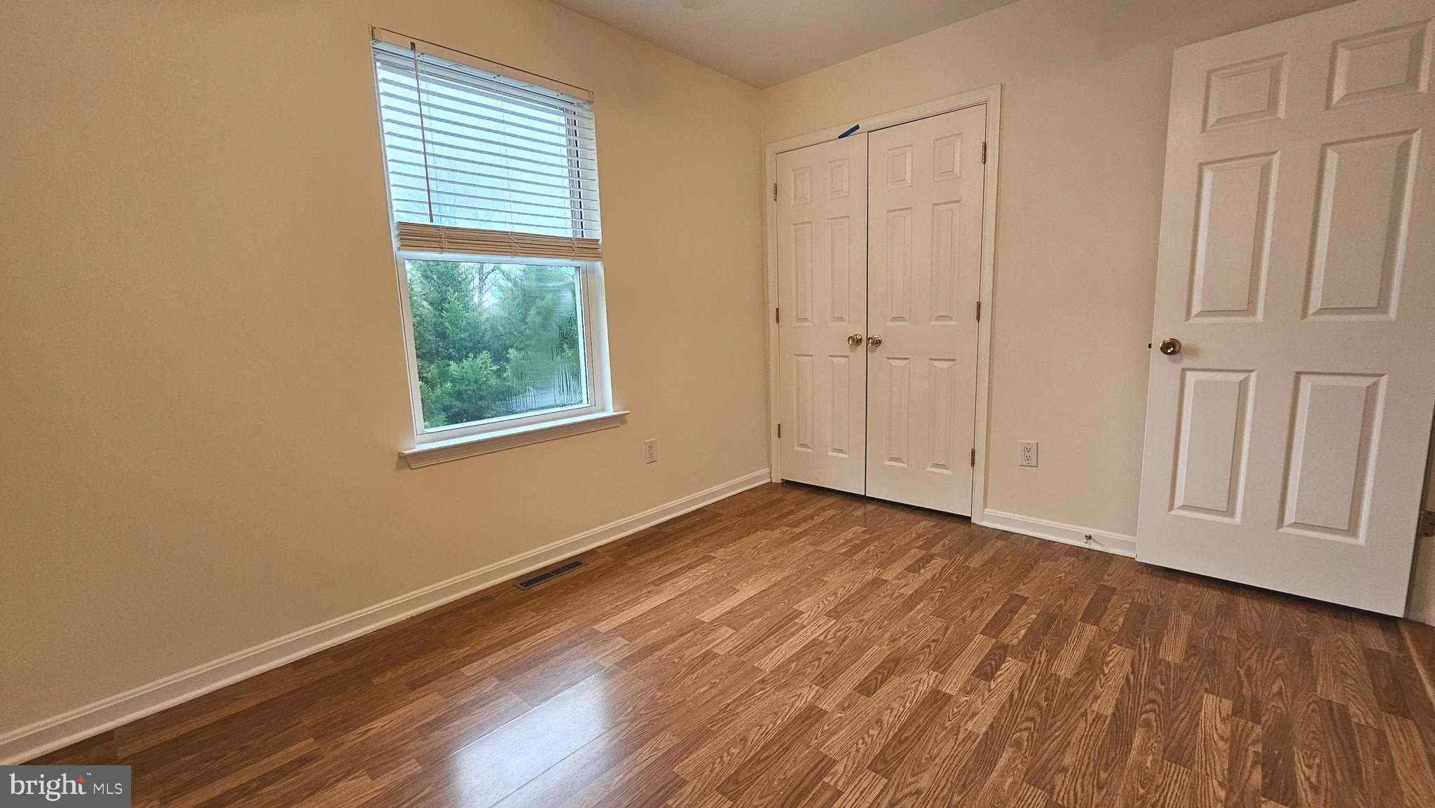 45655 Centerview Lane Great Mills, MD 20634 - Photo 24 of 38 a view of an empty room with wooden floor and a window