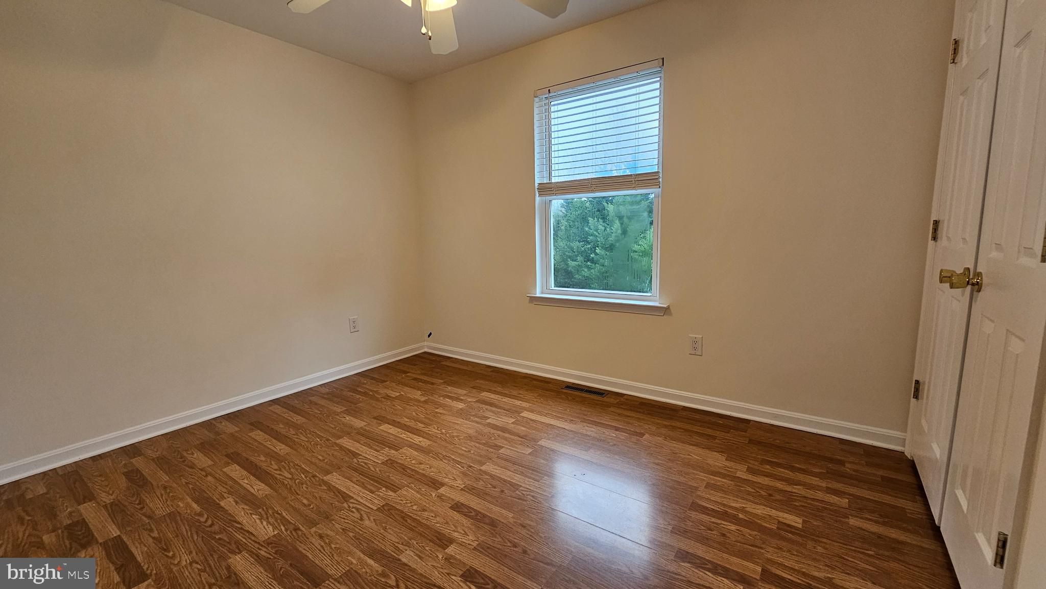 45655 Centerview Lane Great Mills, MD 20634 - Photo 26 of 38 an empty room with wooden floor and windows