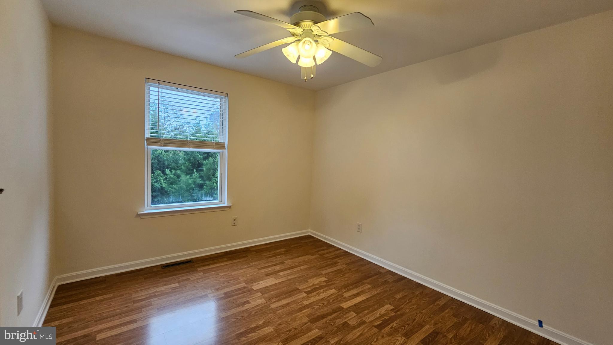45655 Centerview Lane Great Mills, MD 20634 - Photo 27 of 38 a view of empty room with wooden floor and fan