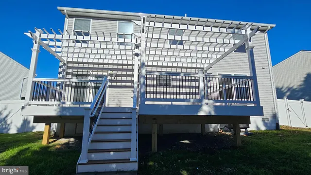 a view of house with backyard
