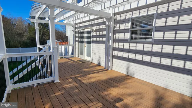 a view of a chairs and deck in the balcony