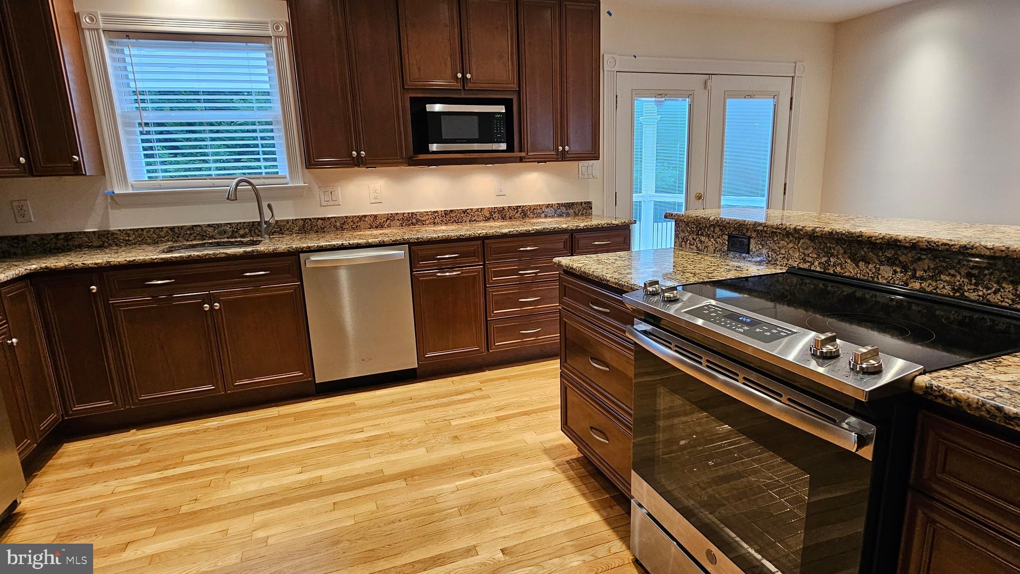 45655 Centerview Lane Great Mills, MD 20634 - Photo 5 of 38 a kitchen with a stove and a sink
