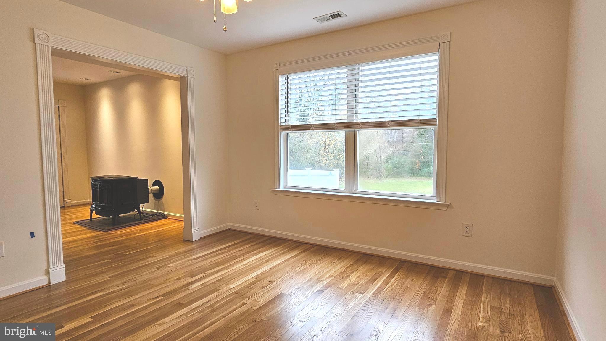 45655 Centerview Lane Great Mills, MD 20634 - Photo 10 of 38 a view of an empty room with a window and wooden floor