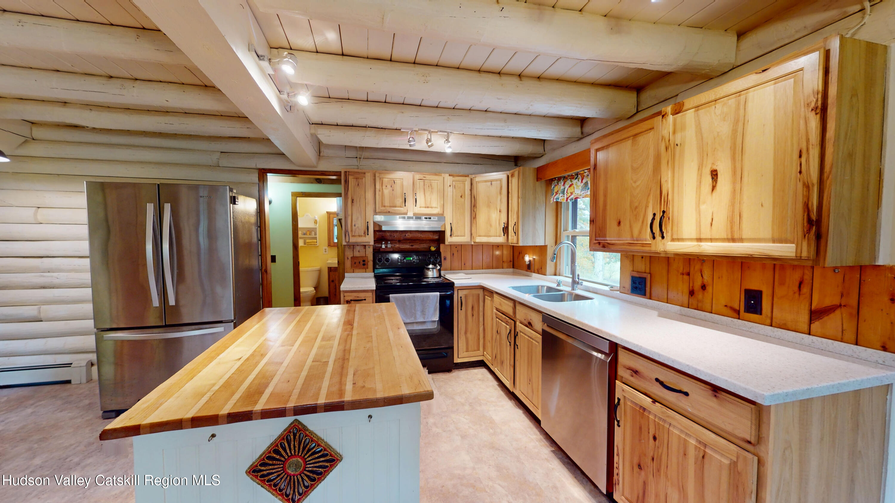 634 Old Plank Road Coxsackie, NY 12042 - Photo 11 of 49 a kitchen with kitchen island granite countertop a sink a counter top space and stainless steel appliances