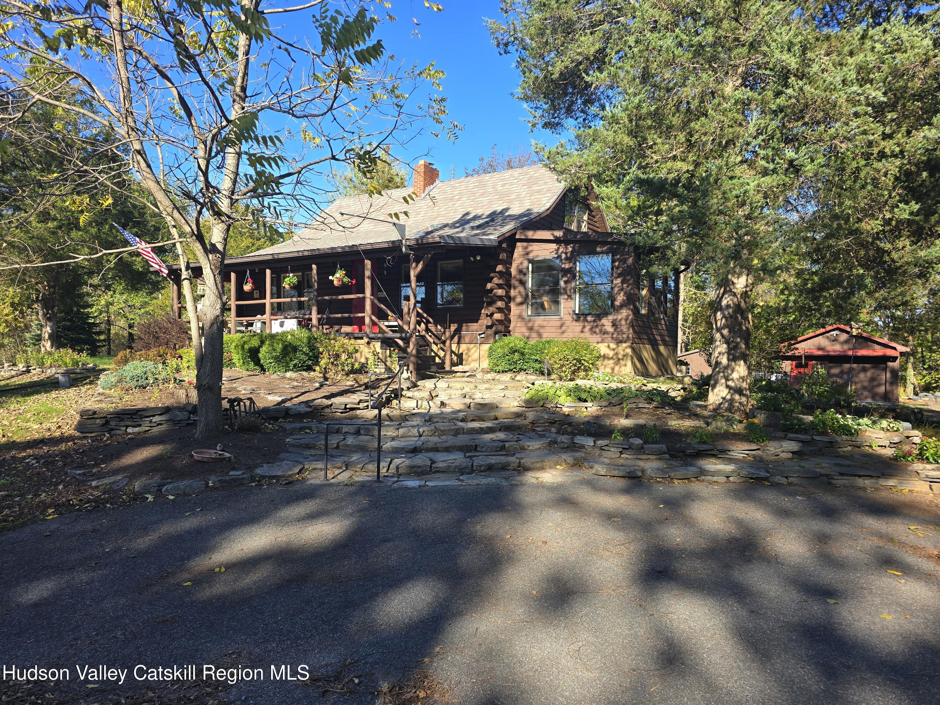 634 Old Plank Road Coxsackie, NY 12042 - Photo 40 of 49 a view of a patio with table and chairs and a large tree