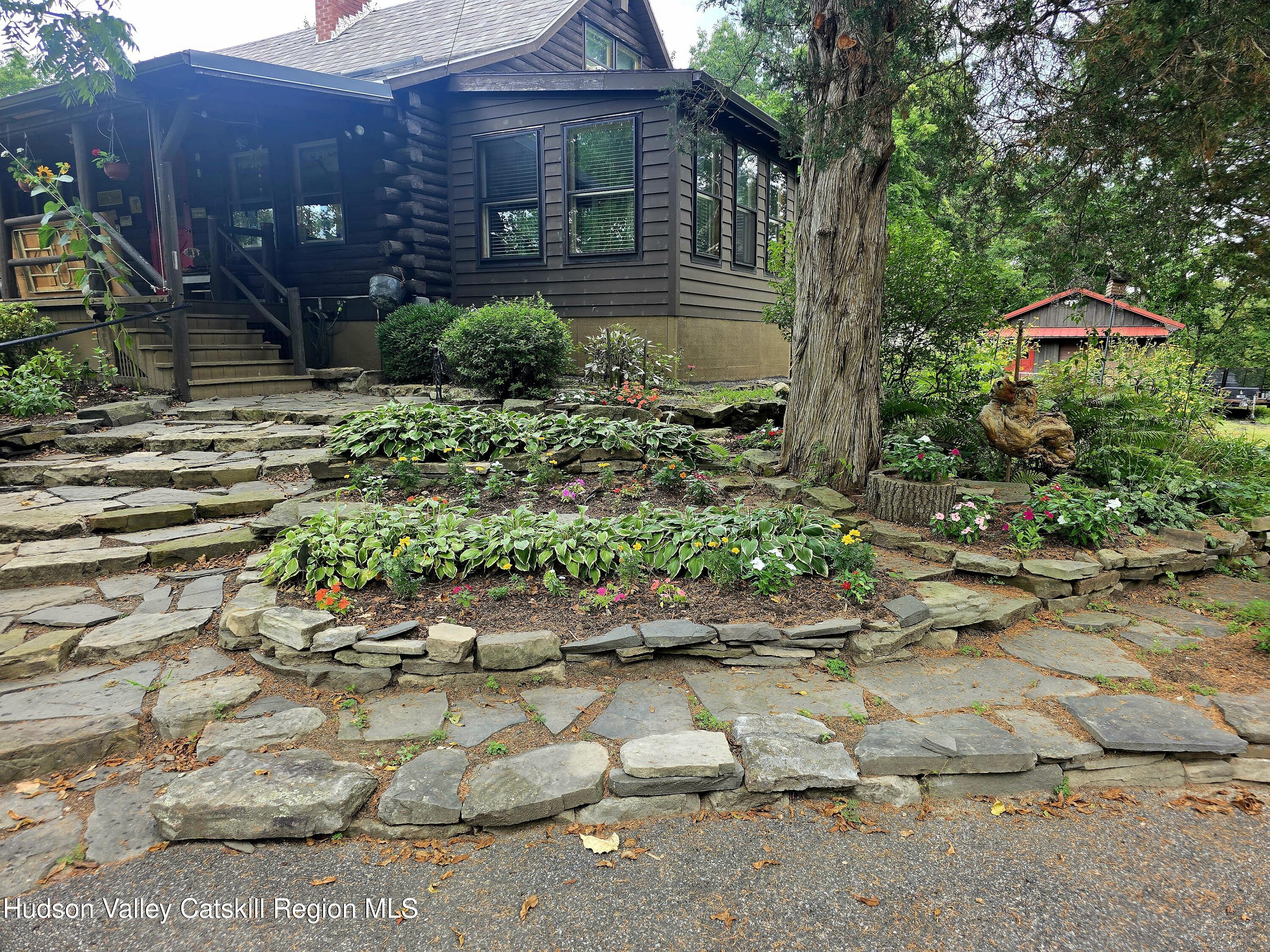 634 Old Plank Road Coxsackie, NY 12042 - Photo 42 of 49 a front view of a house with garden