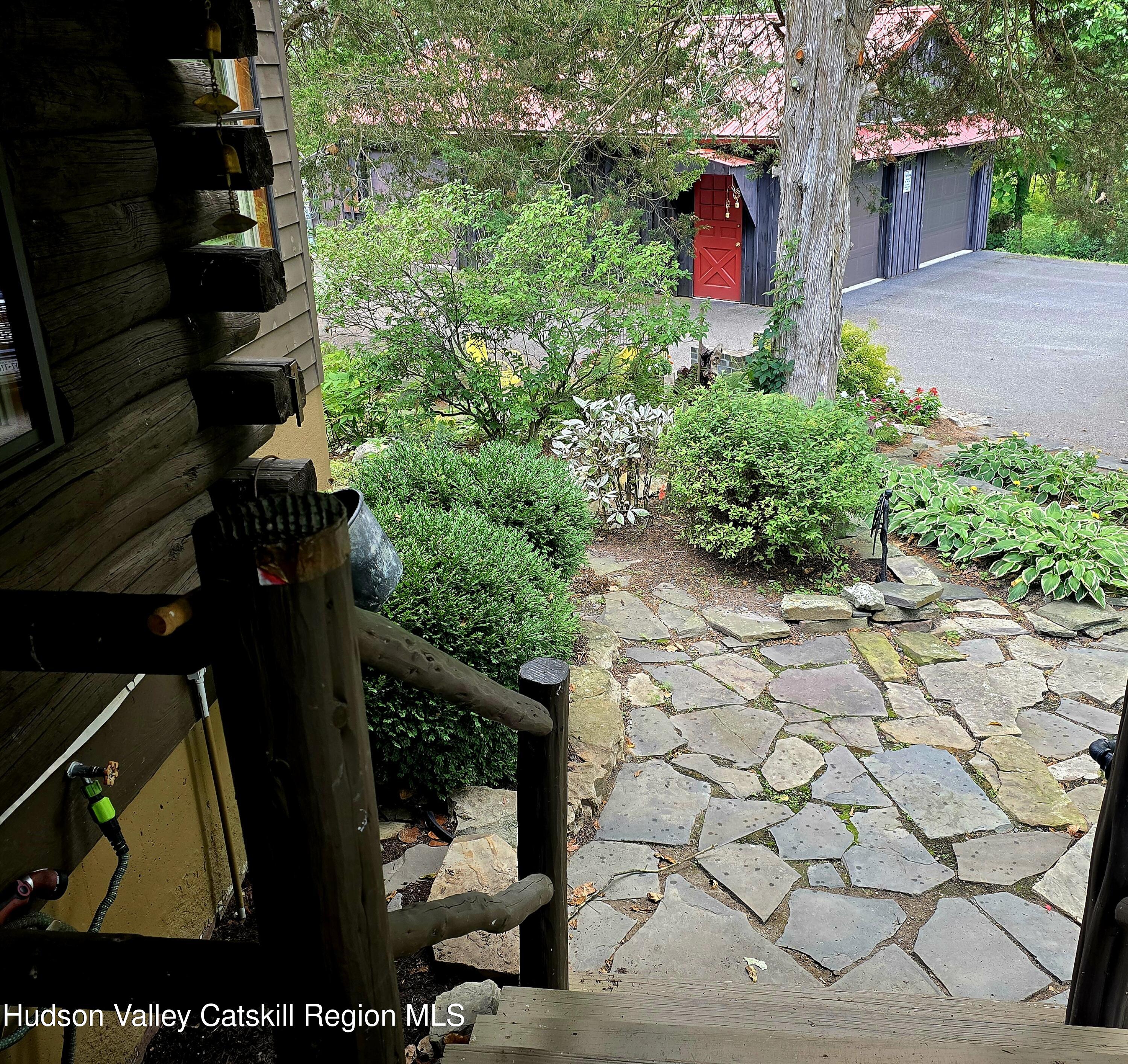 634 Old Plank Road Coxsackie, NY 12042 - Photo 44 of 49 a backyard of a house with lots of green space and a fountain