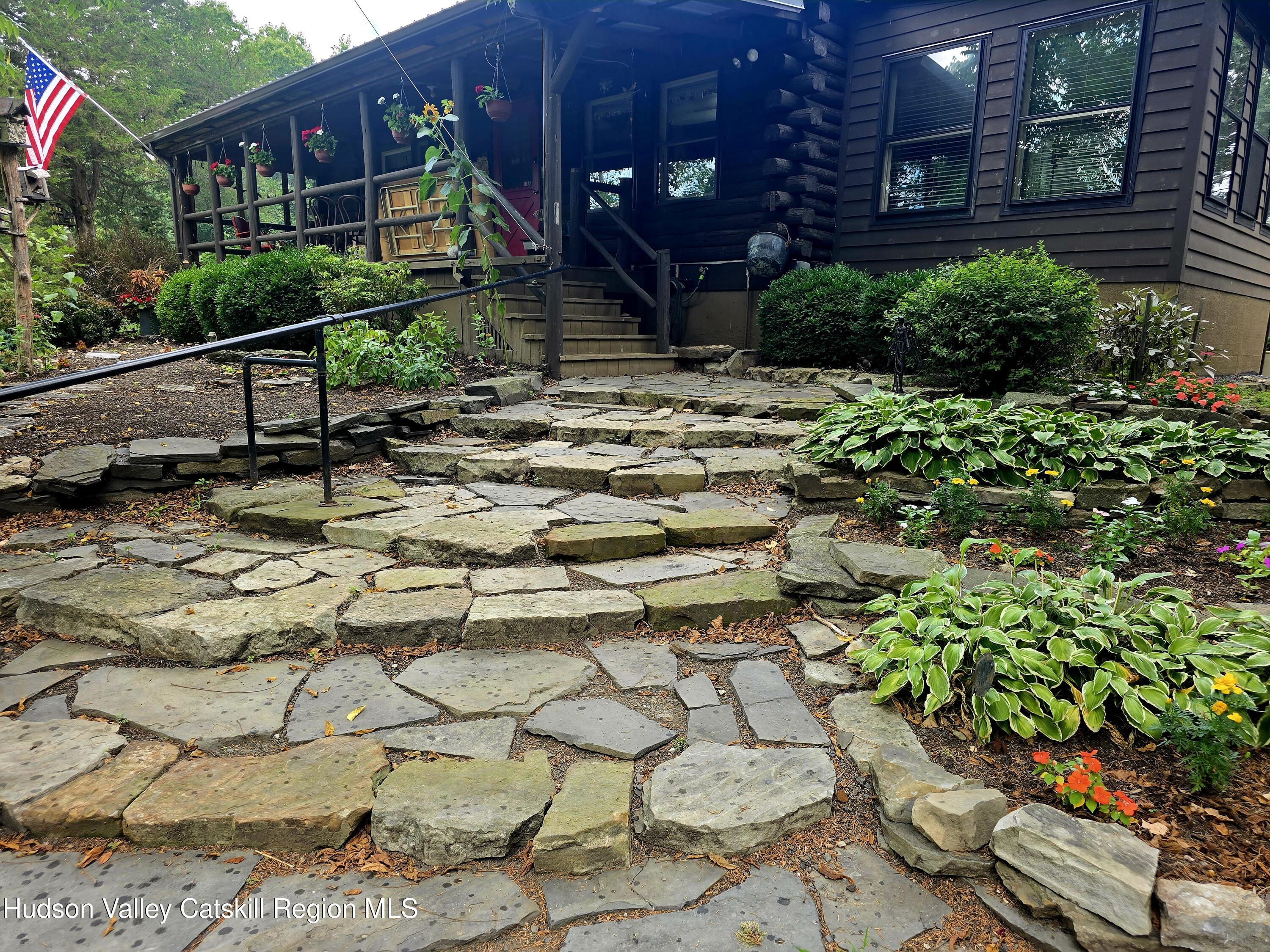 634 Old Plank Road Coxsackie, NY 12042 - Photo 5 of 49 a backyard of a house with lots of green space and fountain