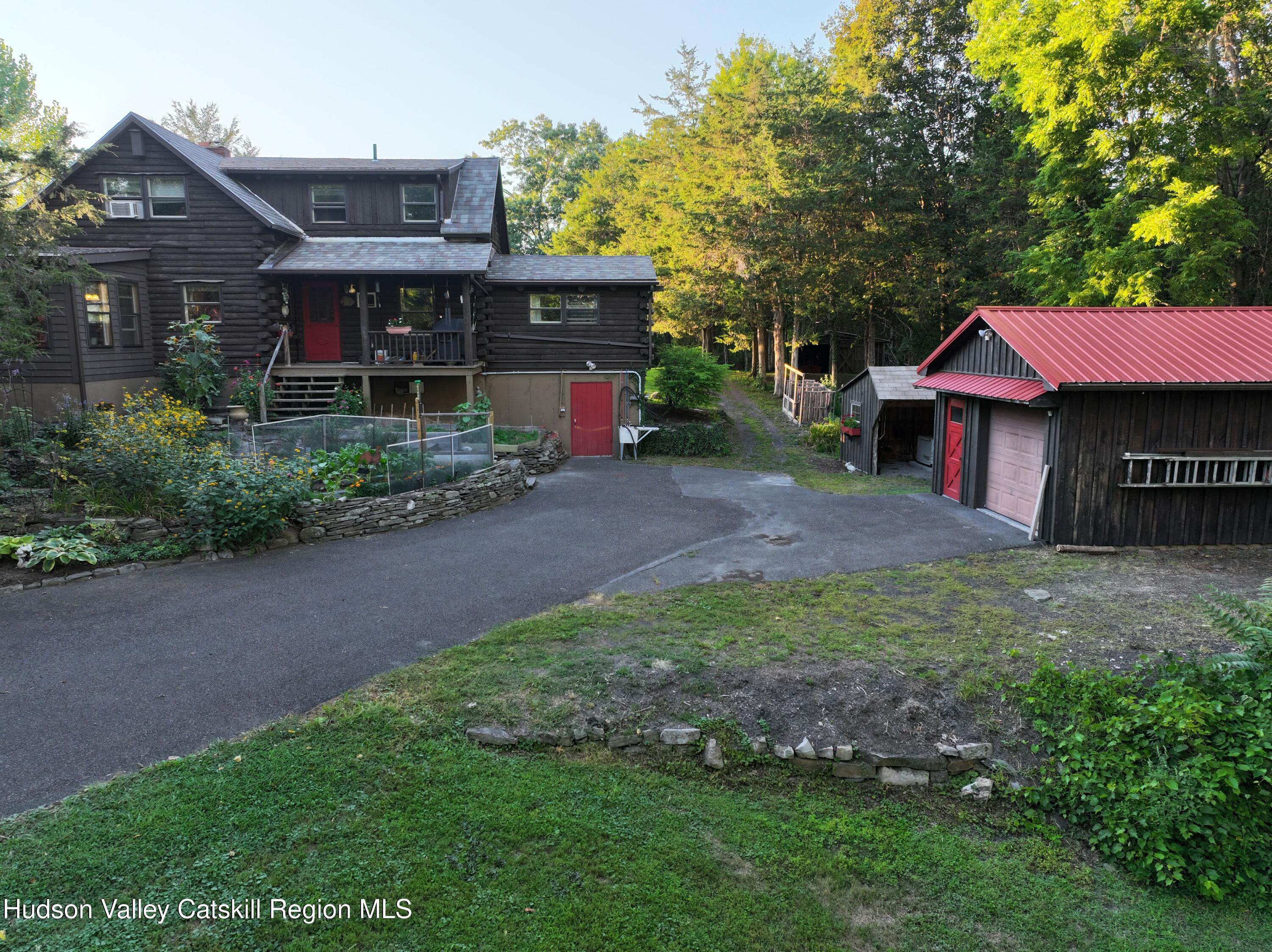 634 Old Plank Road Coxsackie, NY 12042 - Photo 6 of 49 a front view of a house with a garden