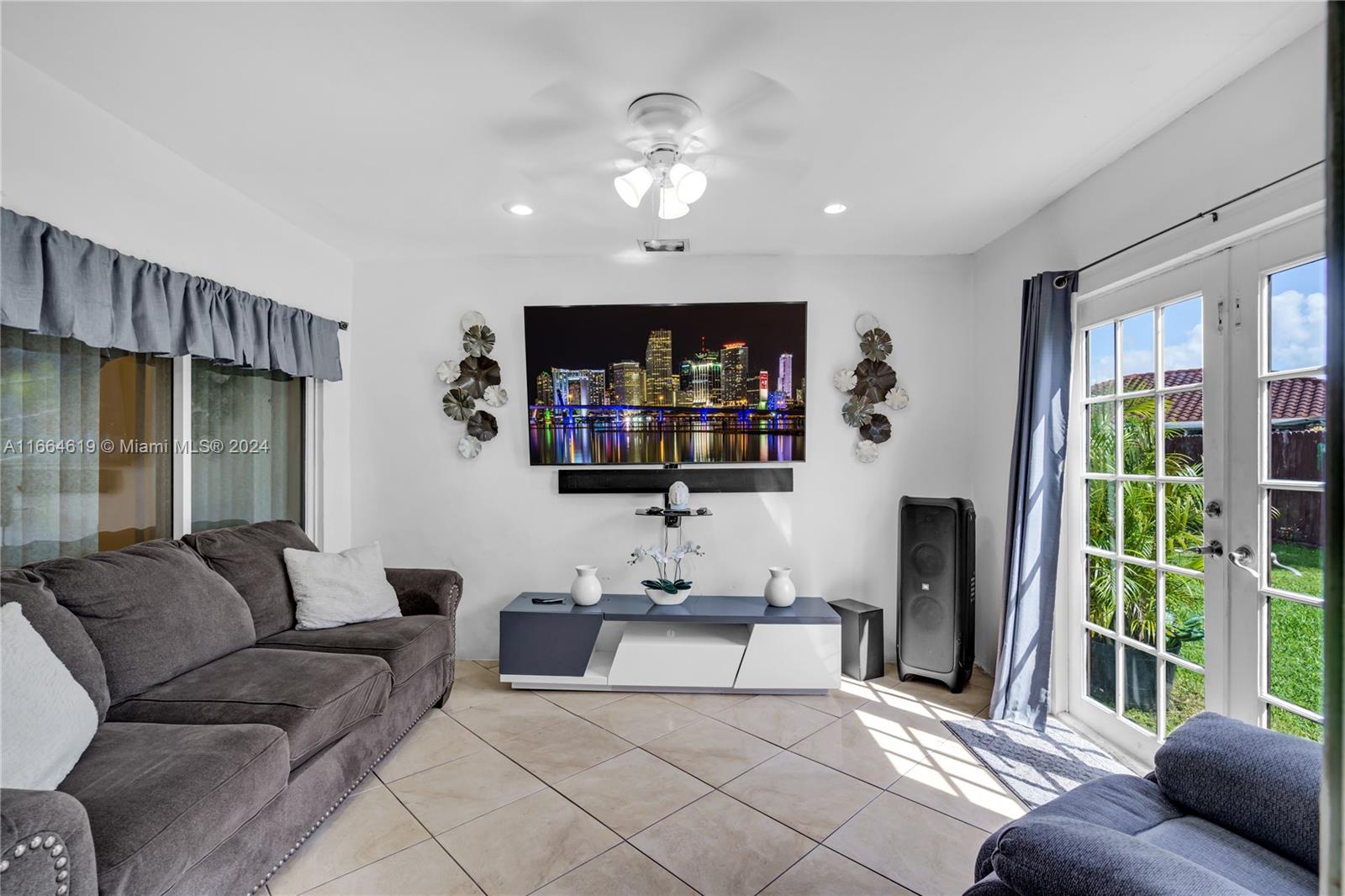 15831 Southwest 143rd Court Miami, FL 33177 - Photo 13 of 27 a living room with furniture and a flat screen tv