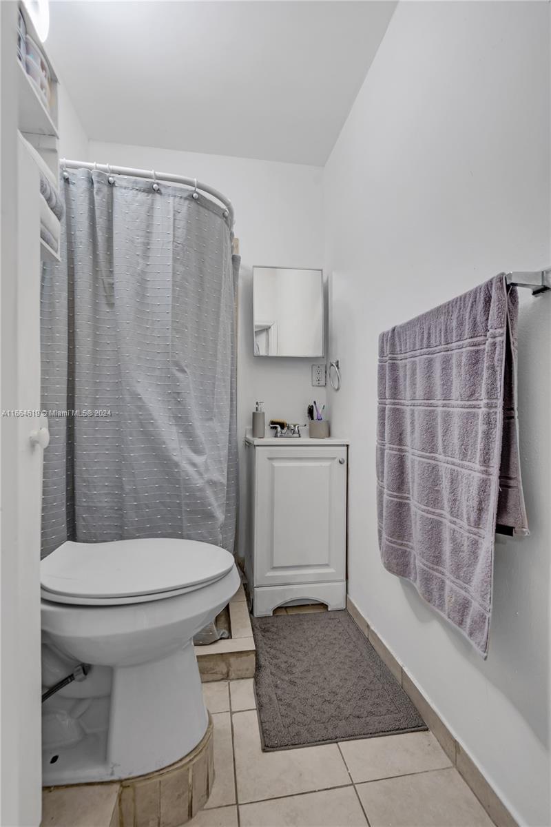 15831 Southwest 143rd Court Miami, FL 33177 - Photo 26 of 27 a bathroom with a sink toilet and shower