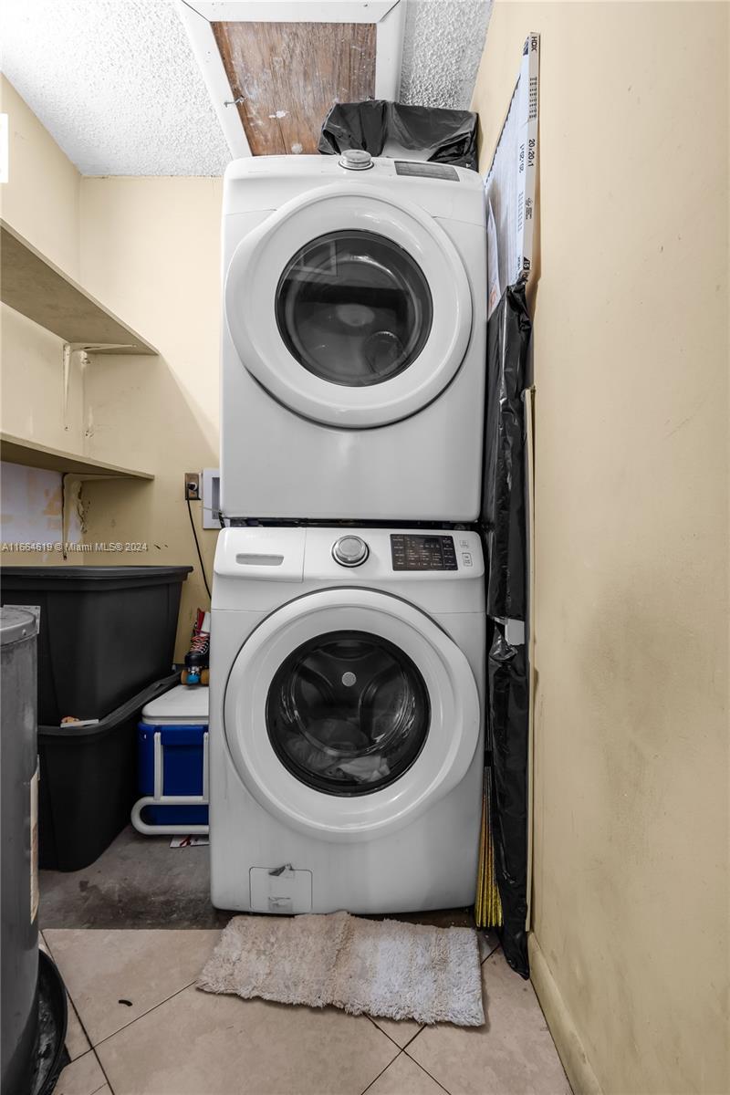15831 Southwest 143rd Court Miami, FL 33177 - Photo 27 of 27 a utility room with dryer and washer