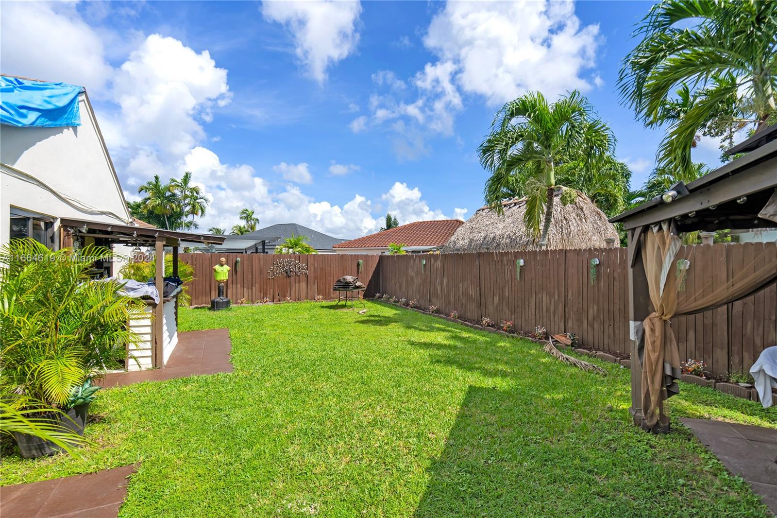 15831 Southwest 143rd Court Miami, FL 33177 - Photo 6 of 27 a view of a backyard with wooden fence