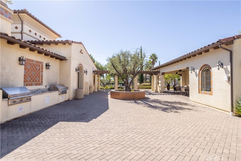 20335 Paseo Meriana Porter Ranch, CA 91326 - Photo 36 of 58 Outdoor BBQ Area Overlooking Relaxing Seating Area