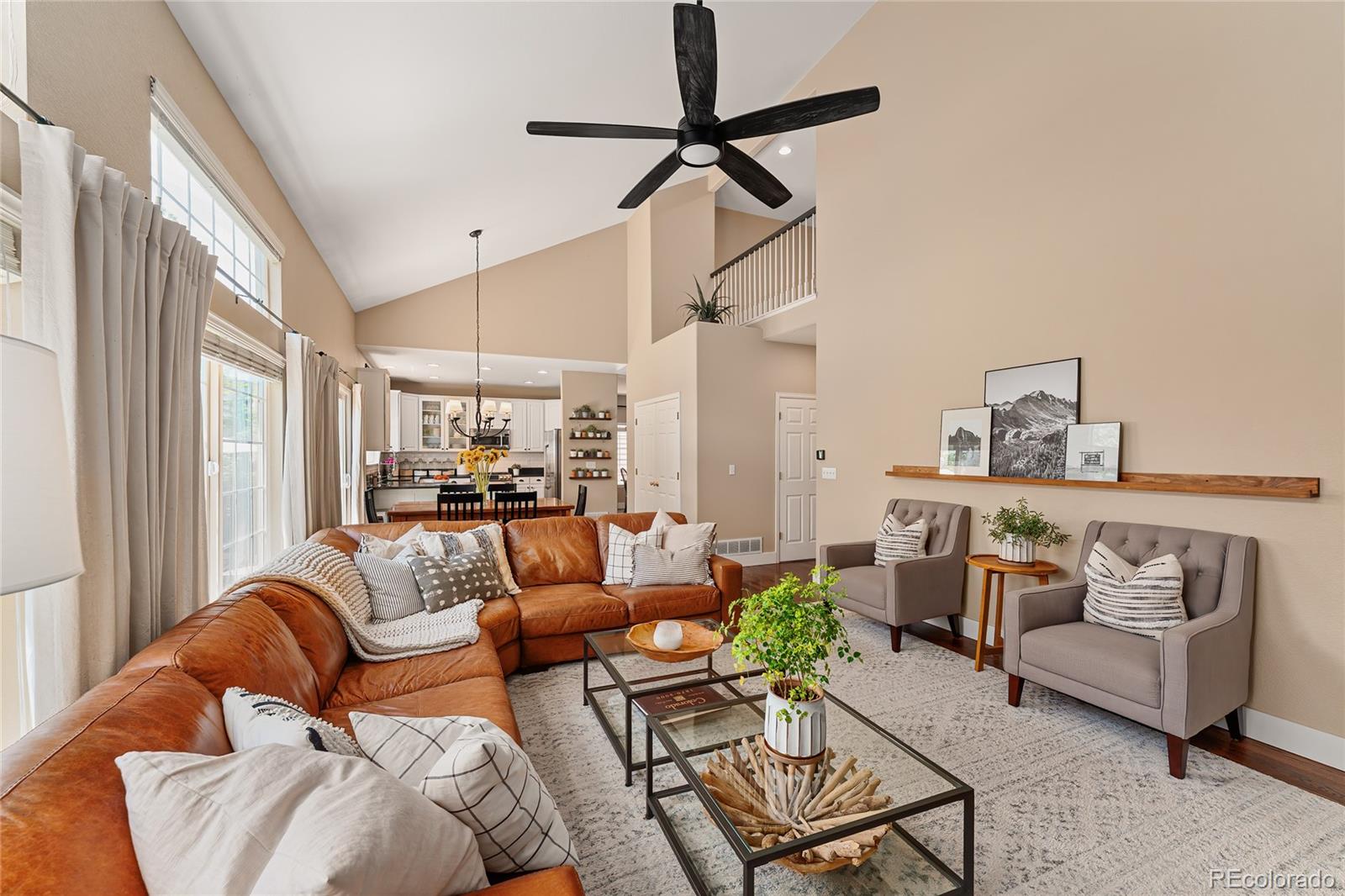 9441 South Hackberry Lane Highlands Ranch, CO 80129 - Photo 24 of 50 a living room with furniture and a ceiling fan