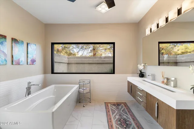 a view of a chairs and a table in the patio