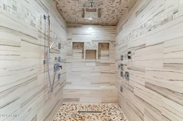 a kitchen with stainless steel appliances granite countertop a refrigerator sink and stove