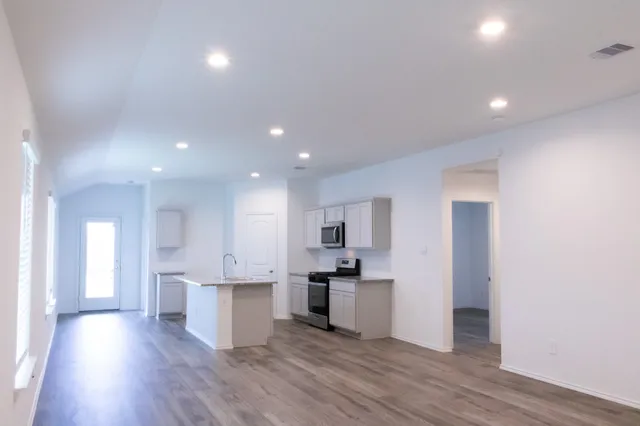 a view of kitchen with wooden floor