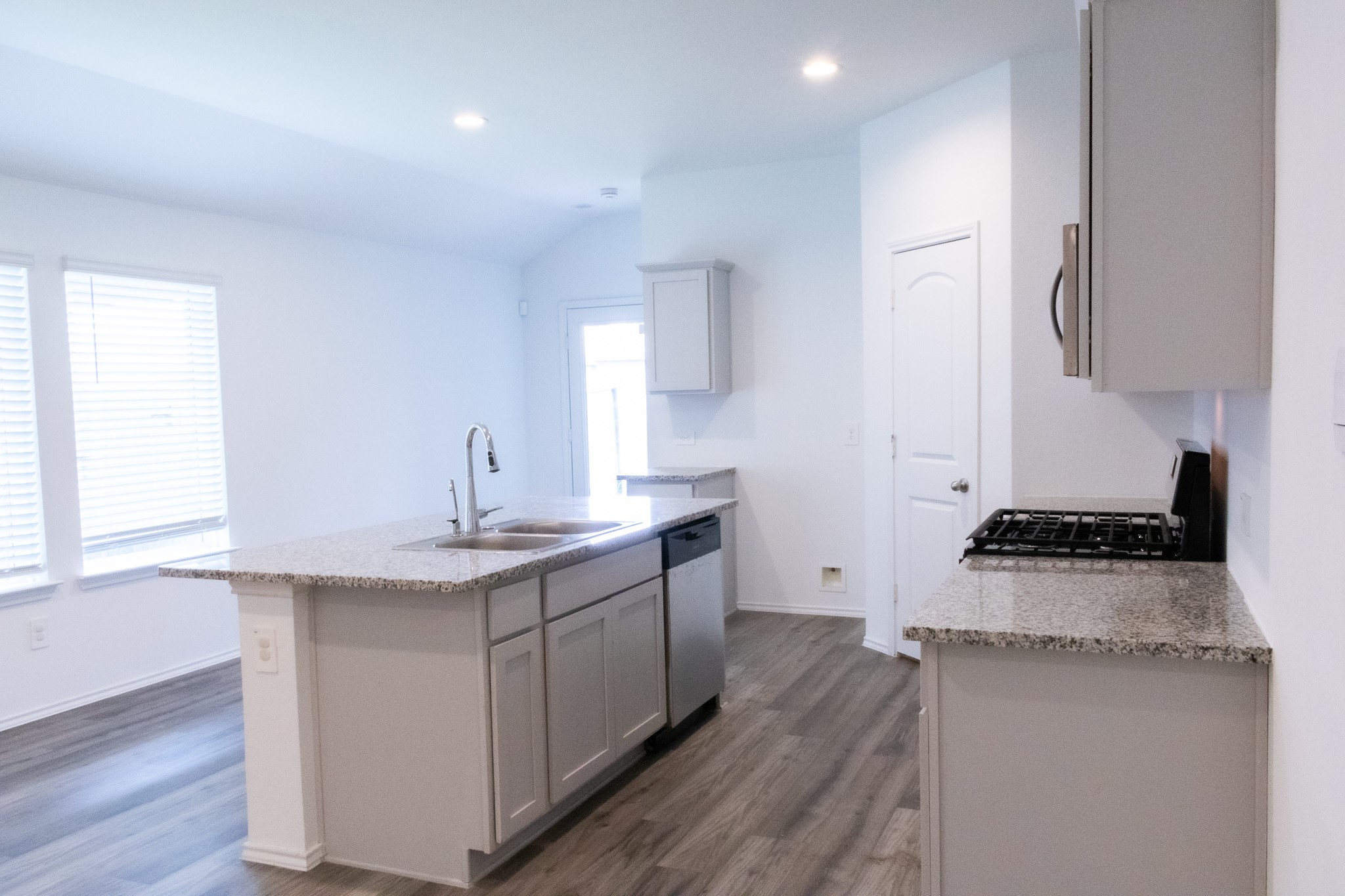 5342 Pinecliff Grove Court Spring, TX 77373 - Photo 6 of 27 a kitchen with stainless steel appliances granite countertop a sink stove and refrigerator