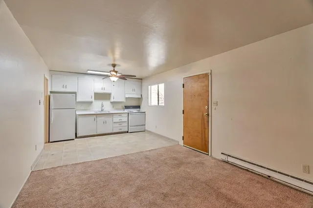 a view of a kitchen with a sink and cabinet