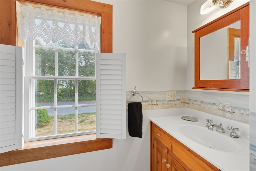 6 Defiance Lane Orleans, MA 02653 - Photo 14 of 27 a bathroom with a sink and a window