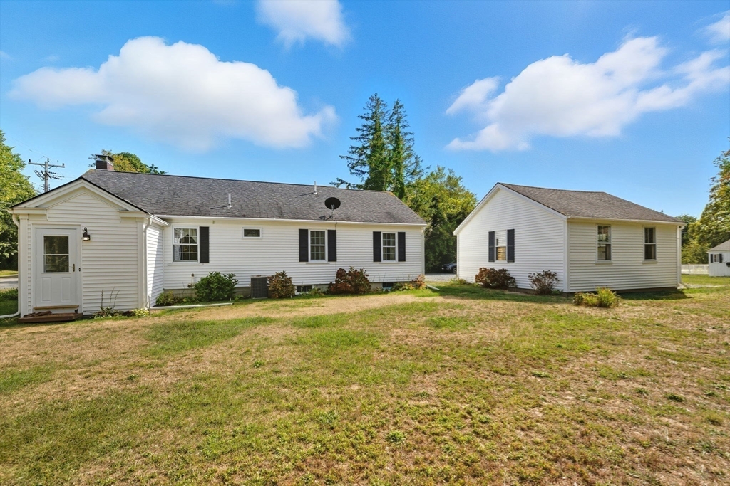 6 Defiance Lane Orleans, MA 02653 - Photo 22 of 27 a view of a yard in front of a house with a large tree