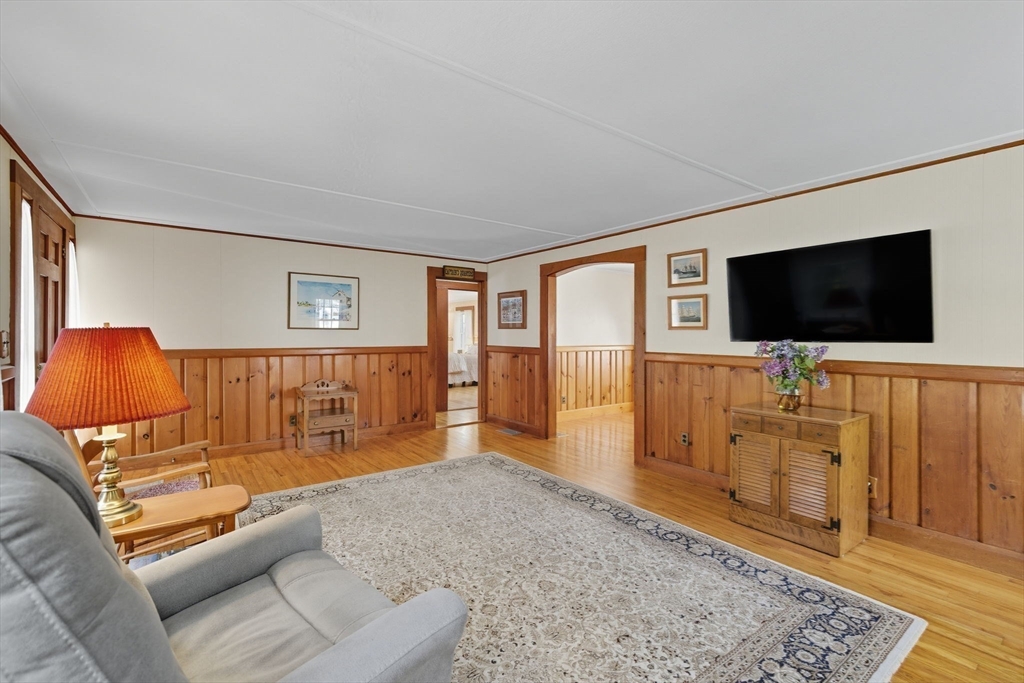 6 Defiance Lane Orleans, MA 02653 - Photo 4 of 27 a bedroom with furniture and a flat screen tv