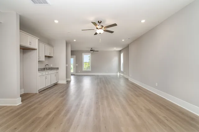 a view of a room with yard from a balcony