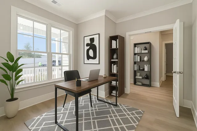 a workspace with furniture and a potted plant