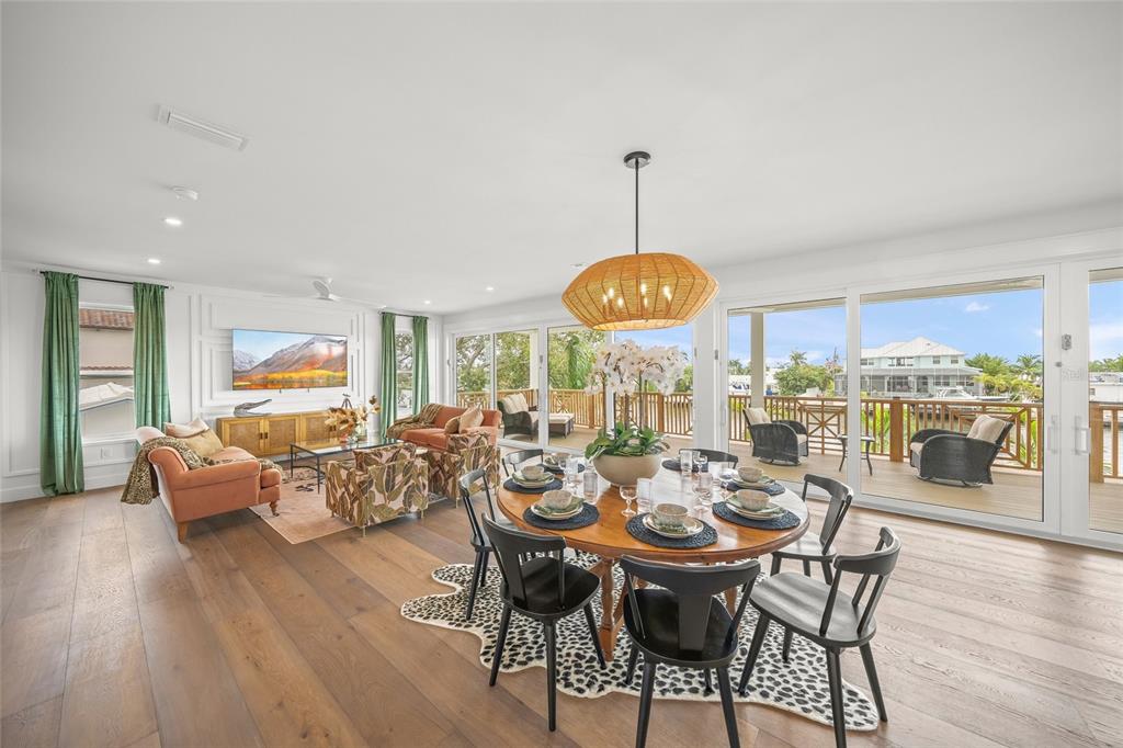 525 68th Street Holmes Beach, FL 34217 - Photo 15 of 52 a view of a dining room with furniture window and wooden floor