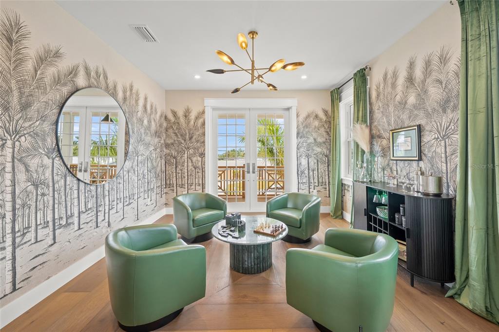 525 68th Street Holmes Beach, FL 34217 - Photo 20 of 52 a living room with fireplace furniture and a large window